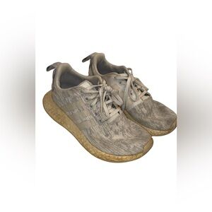 Moderately worn white adidas NMDs